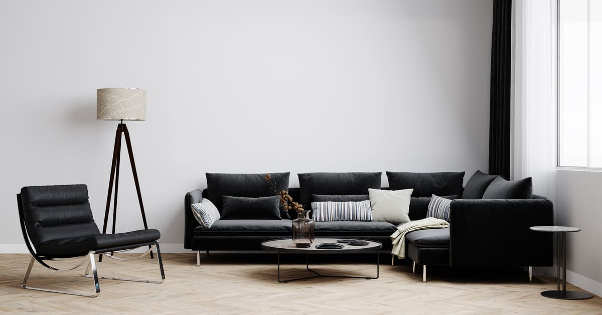 como decorar un sofa negro con cojines